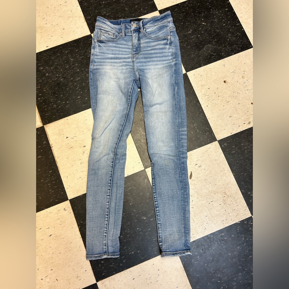 Buckle black skinny jeans